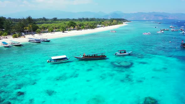 Aerial drone shot travel of paradise island beach trip by aqua blue ocean and white sandy background