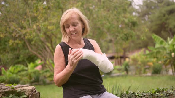 Senior Elderly Woman Massaging Hand Suffering From Joint Pain