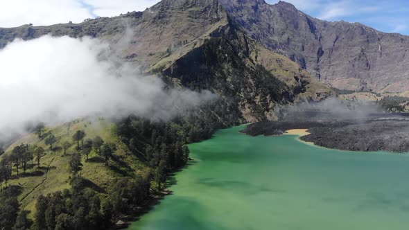 Aerial video of low laying clouds over Mount Rinjani in Indonesia (1)