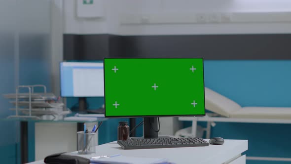 Closeup of Mock Up Green Screen Chroma Key Computer with Isolated Display Standing on Table