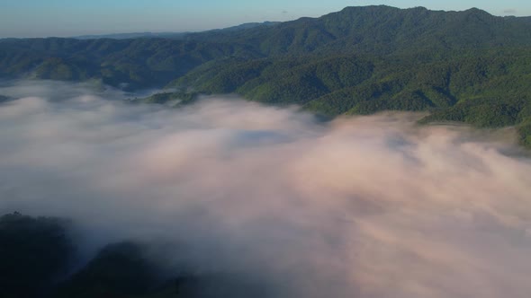 4K Drone Flying through the clouds at dusk or dawn. Aerial top cloudscape