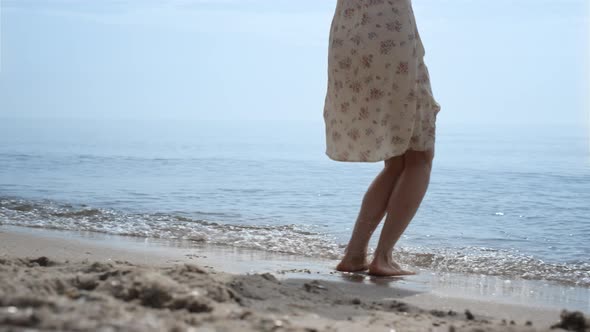 Bare Woman Feet Jumping in Ocean Water Close Up