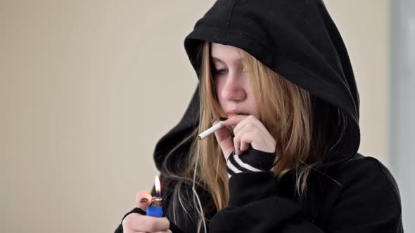 A Teenage Girl is About to Smoke but Something Stops Her