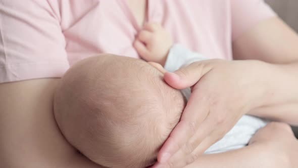 Newborn Baby Hand Holding Mother Mom Breastfeeding Touching Baby Tiny Hand to Make Him Feeling Her