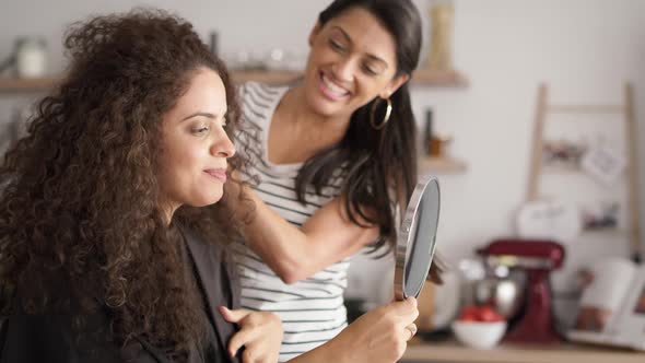 Video of happy women starting hair beauty treatments at home. Shot with RED helium camera in 8K.