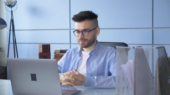 Close Up Man Person Using Video Conferencing technology in Home Office for video call