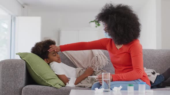 Mother taking care of her sick son at home