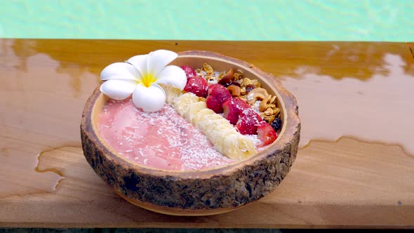 Acai Smoothie Bowl with Banana Strawberries Granola and Coconut Flakes