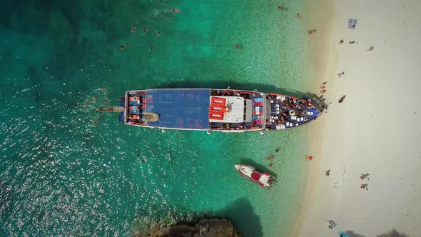 Aerial view above people disembarking off ferry, Ithaki, Greece.