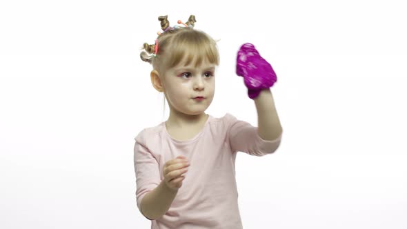 Kid Playing with Hand Made Toy Slime. Child Having Fun Making Purple Slime