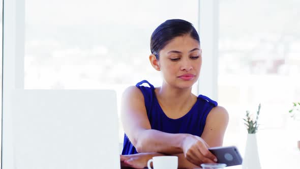 woman calling on smartphone in office