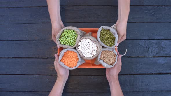 Legumes on Dark Wooden Ecological Background.