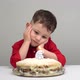 Upset White Child on His Birthday. Alone Child Sits in Front of Cake with Candles. - VideoHive Item for Sale