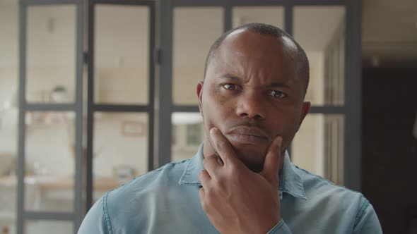 Portrait of Pensive African Man in Deep Thoughts