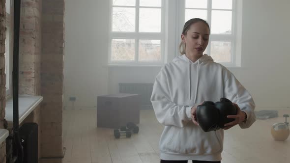 Woman With Boxing Gloves At Loft Gym Studio