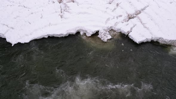 Waterfall Prut in the Winter. Rapid Flow of Water From a Mountain Creek and Stone Rapids with Snow