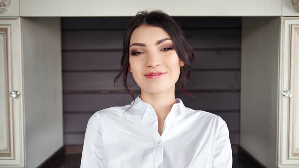 Portrait of Smiling Beautiful Brunette Woman Posing Looking at Camera