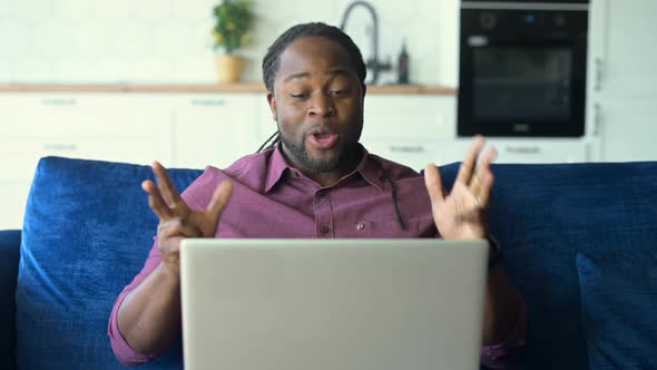 Black Man Using Laptop for Video Call