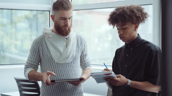 Men Discussing Startup Plan in Office