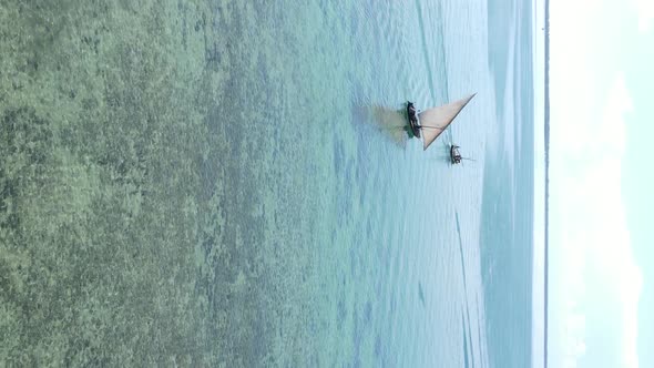 Tanzania Vertical Video  Boat Boats in the Ocean Near the Coast of Zanzibar Aerial View