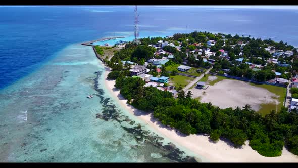 Aerial above texture of luxury coastline beach holiday by blue ocean and white sand background of a 