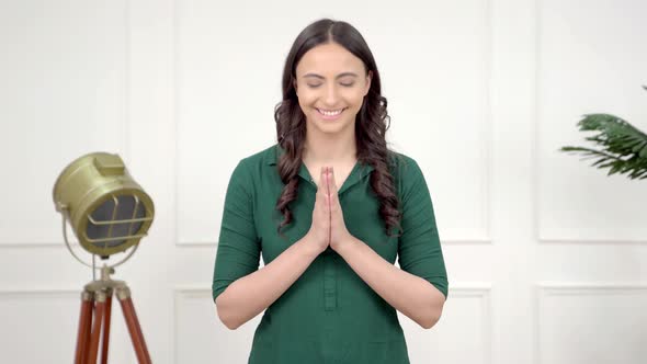 Indian girl saying Namaste
