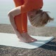 Flexible Woman Leaning to Legs Stretching Morning Workout at Sea - VideoHive Item for Sale