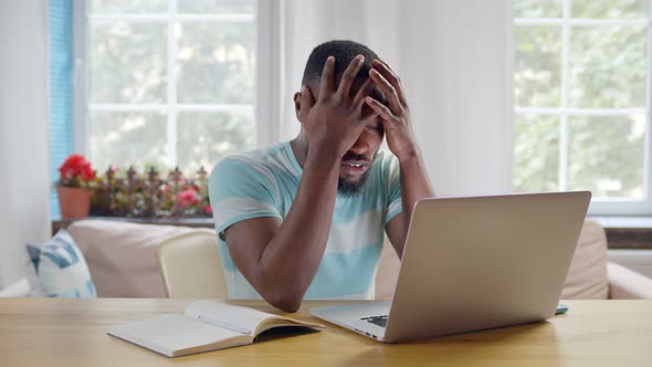 Depressed Young Afro Entrepreneur Deal with Finance Problems From Home