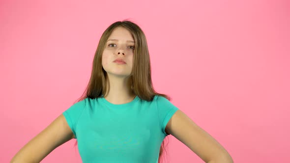 Little Female Is Angry and Unsatisfied on Pink Background