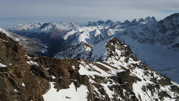 Aerial View of Cheget Mountain Range in Snow in Winter in Sunny Clear Weather