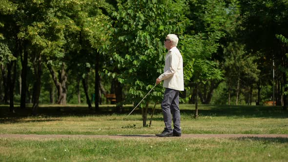 Woman Returning Lost Keys to Blind Man Walking Alone in Park, Human Kindness