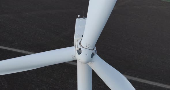 Wind Turbine Blades and Rotor Turn in Close Up Drone View