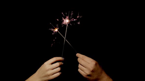 Closeup Hands Holding Waving Bengal Fire Burning Sparklers Front Black Background