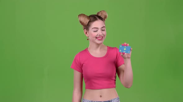 Teenager Advertises a Card and Shows a Thumbs Up. Green Screen. Slow Motion