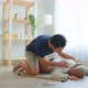 Asian young son helping senior male from falling on the ground at home. - VideoHive Item for Sale