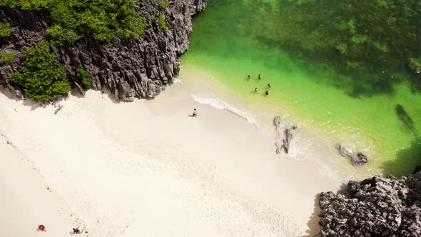 Tourists Relax on the Beach. Caramoan Islands, Camarines Sur, Matukad, Philippines. Tropical Island