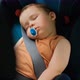A Little Boy Sleeps in a Chair. Children's Safety Systems in Cars. - VideoHive Item for Sale