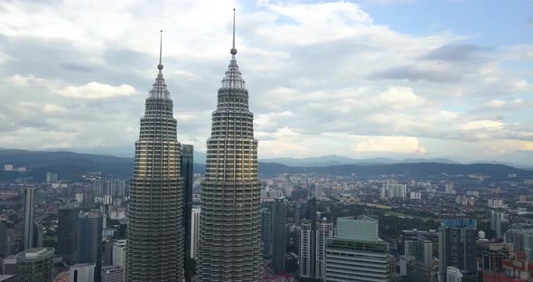 Aerial View on Petronas Twin Towers, Drone Flies Around the Towers, Sunset, Kuala Lumpur, Malaysia