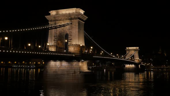 Famous Szechenyi Bridge in Budapest over river Danube by night 4K 2160p UltraHD footage - Chain Brid