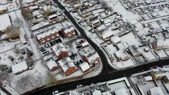 Aerial footage in the winter time on a snowy day of the British town of Mirfield in Kirklees