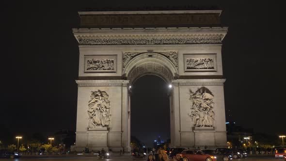 Arc de Triomphe and car traffic in night Paris, France