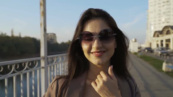 Beautiful Brunette Businesswoman In Business Clothes Walks In The City