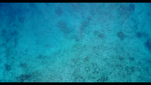 Aerial above texture of relaxing tourist beach vacation by blue lagoon and white sand background of 