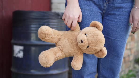 Closeup of Teddy Bear in Female Caucasian Hand