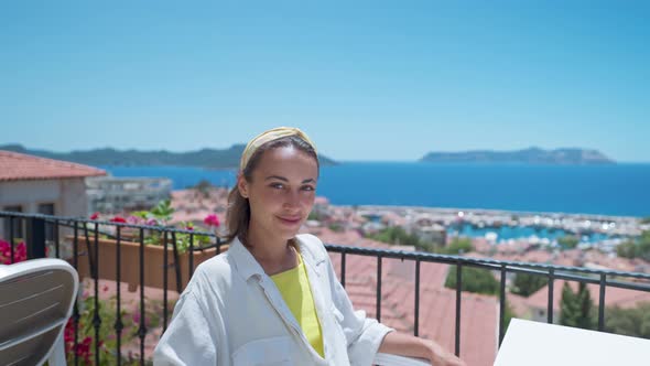 Portrait with Parallax Effect of Young Mixed Race Smiling Woman Sitting on Open Terrace with