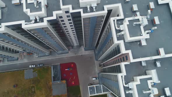 Highrise Apartment Buildings with Yard Near Road Junction