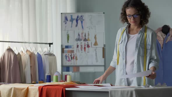 Girl Looking at Outline of New Clothes Collection, Young Designer, Creativity