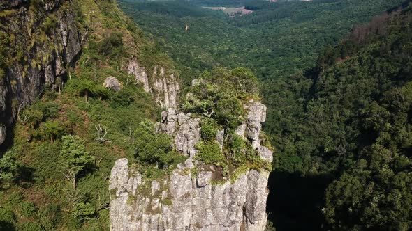 Aerial Drone Shot of A Steep Mountain Pillar Formation in Drakensberg, South Africa