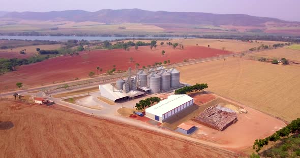 Grain storage silos in the field. agricultural concept. aerophotography. Drone image.