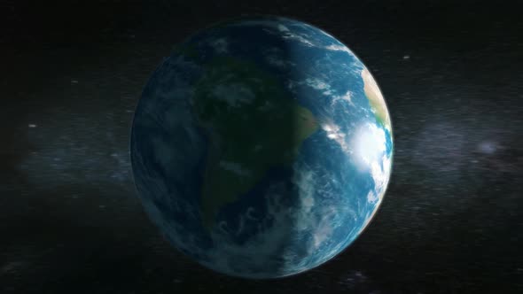 Animation of Earth seen from space, the globe spinning on satellite view on dark background.